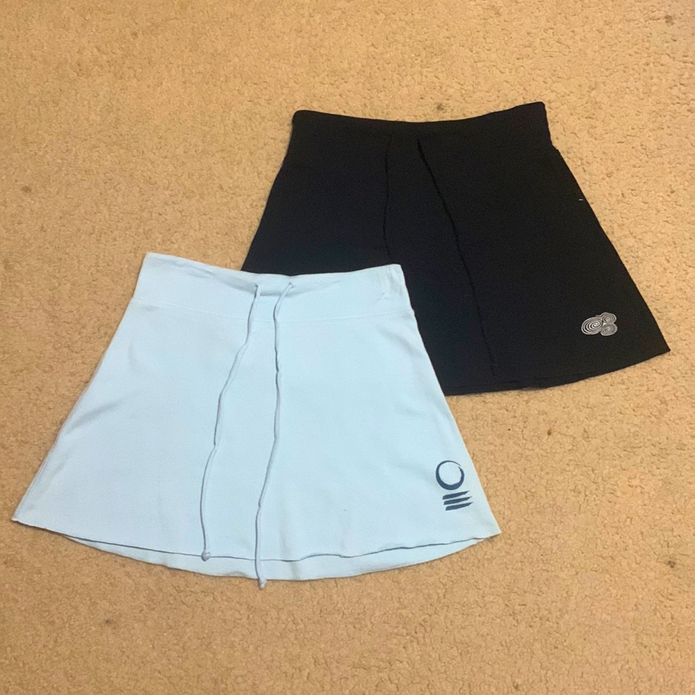 Two black and blue skirts from the brand TT stretch.Good condition women’s M.